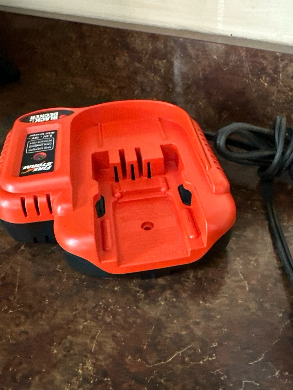 Fire storm by Black & Decker one hour rapid charger for 9.6-18V batteries. Works